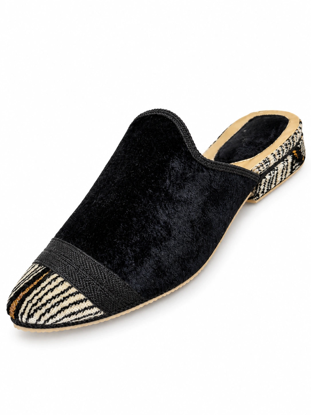Black textured babouche with a cream and black striped toe, dark braided band and matching striped heel on white.