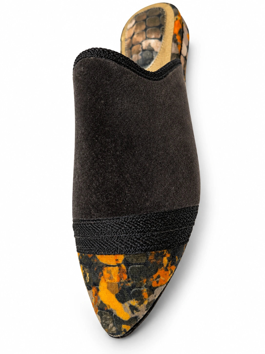 Black babouche with a yellow and grey patterned toe and a black braided band on a white background.