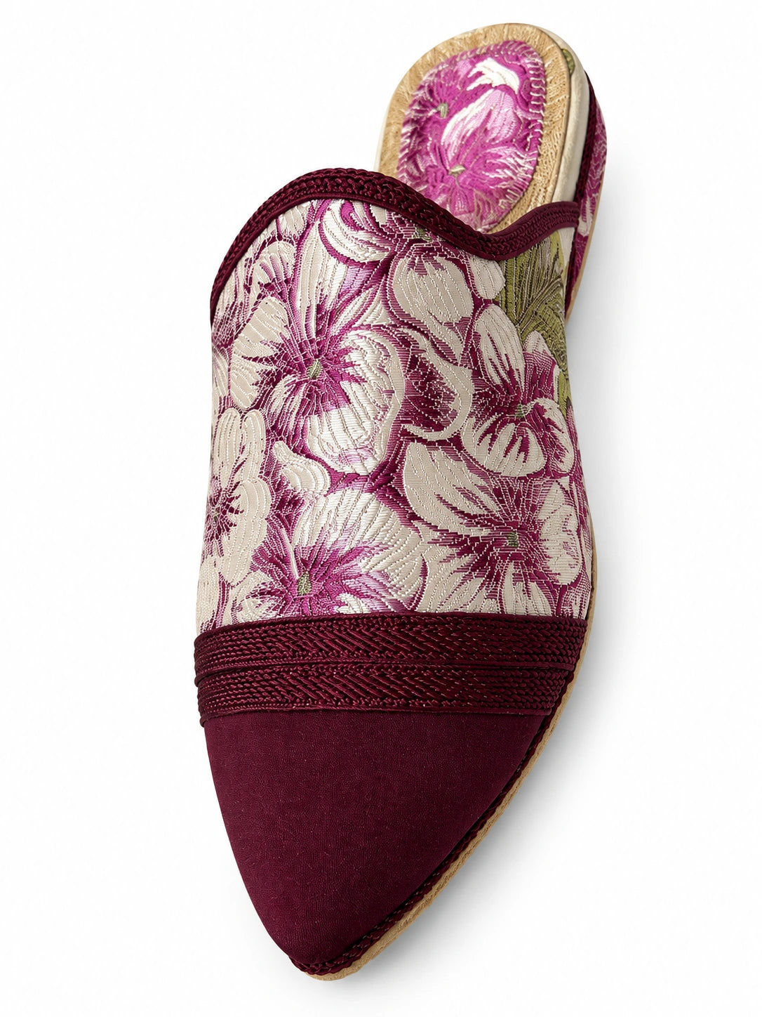 Burgundy babouche with an ivory and magenta floral upper, braided band and plain pointed toe on a white background.
