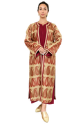 Burgundy and sand Moroccan kaftan set styled in courtyard