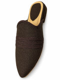 Dark brown woven babouche with three tonal braided bands and a pointed toe on a white background.