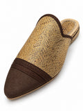 Gold and brown scale-patterned babouche with a dark brown pointed toe and matching braided trim on white.