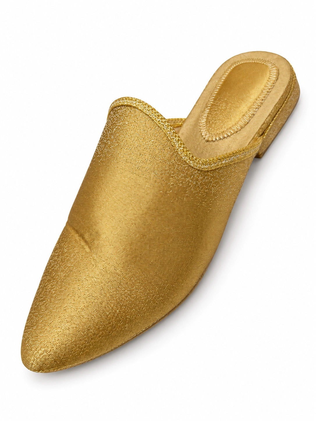 Plain gold-tone babouche with fine surface texture, braided edging and a pointed toe, shown on white.