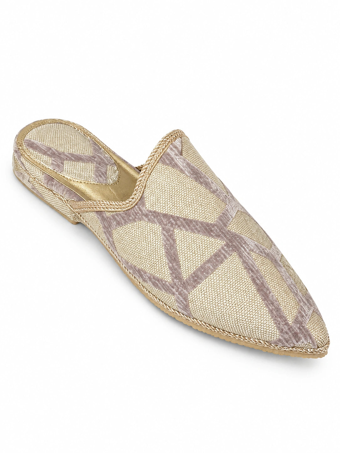 Ivory babouches with pale taupe geometric bands over a finely woven background, on a white background.