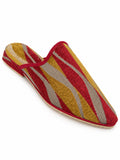 Babouche with red, mustard and grey diagonal stripes, red braided trim and an open back on white.