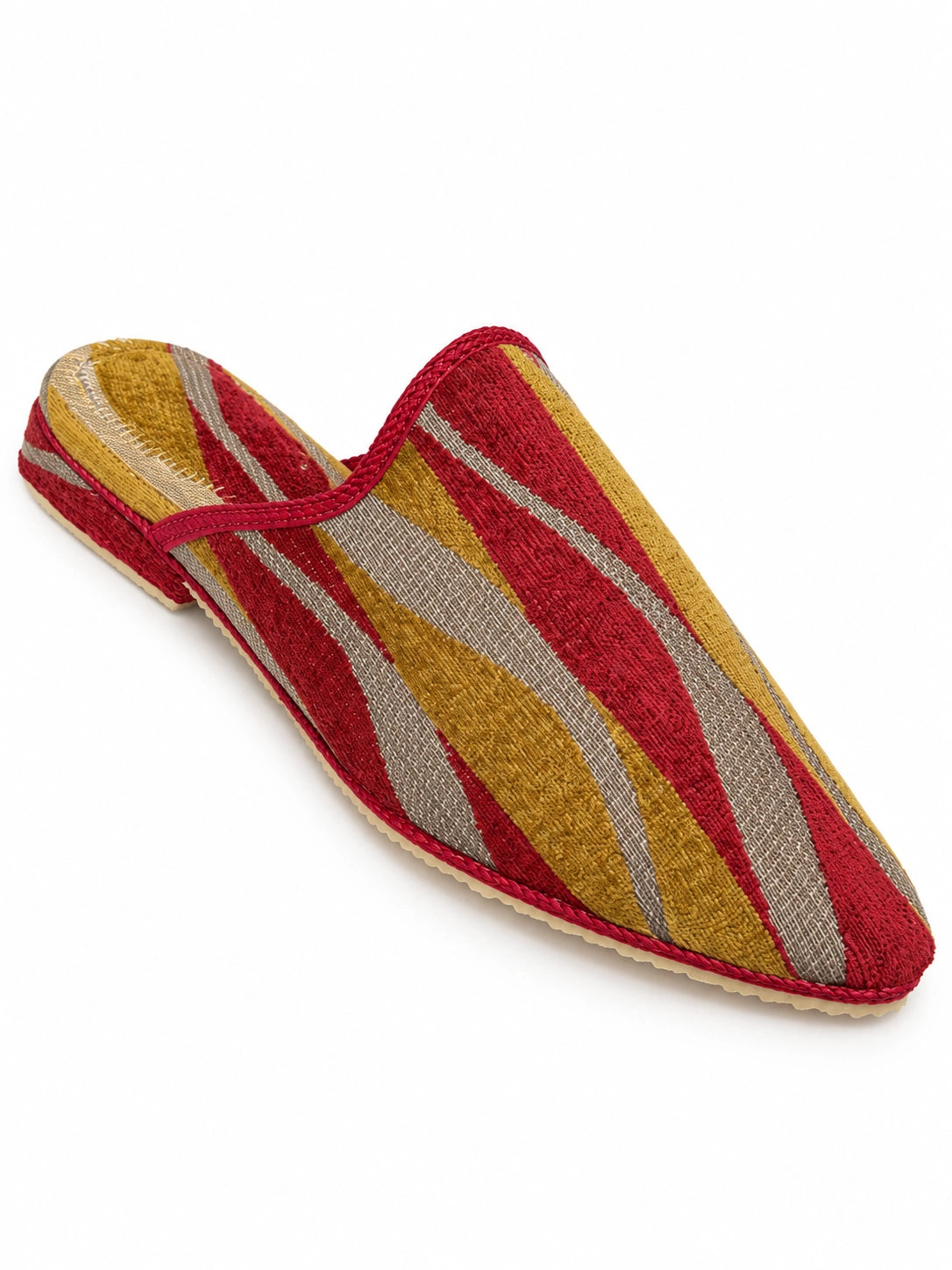 Babouche with red, mustard and grey diagonal stripes, red braided trim and an open back on white.