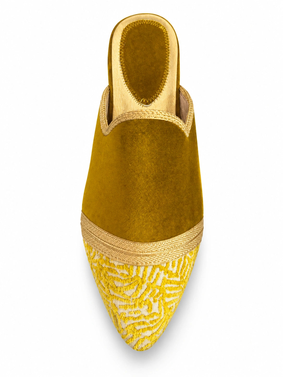 Mustard babouche with a yellow and cream patterned toe and gold-tone braided band on a white background.