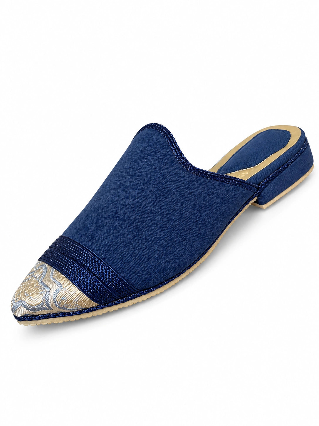 Navy babouches with a pointed toe, tonal braided band and a contrasting ornamental toe panel, on a white background.