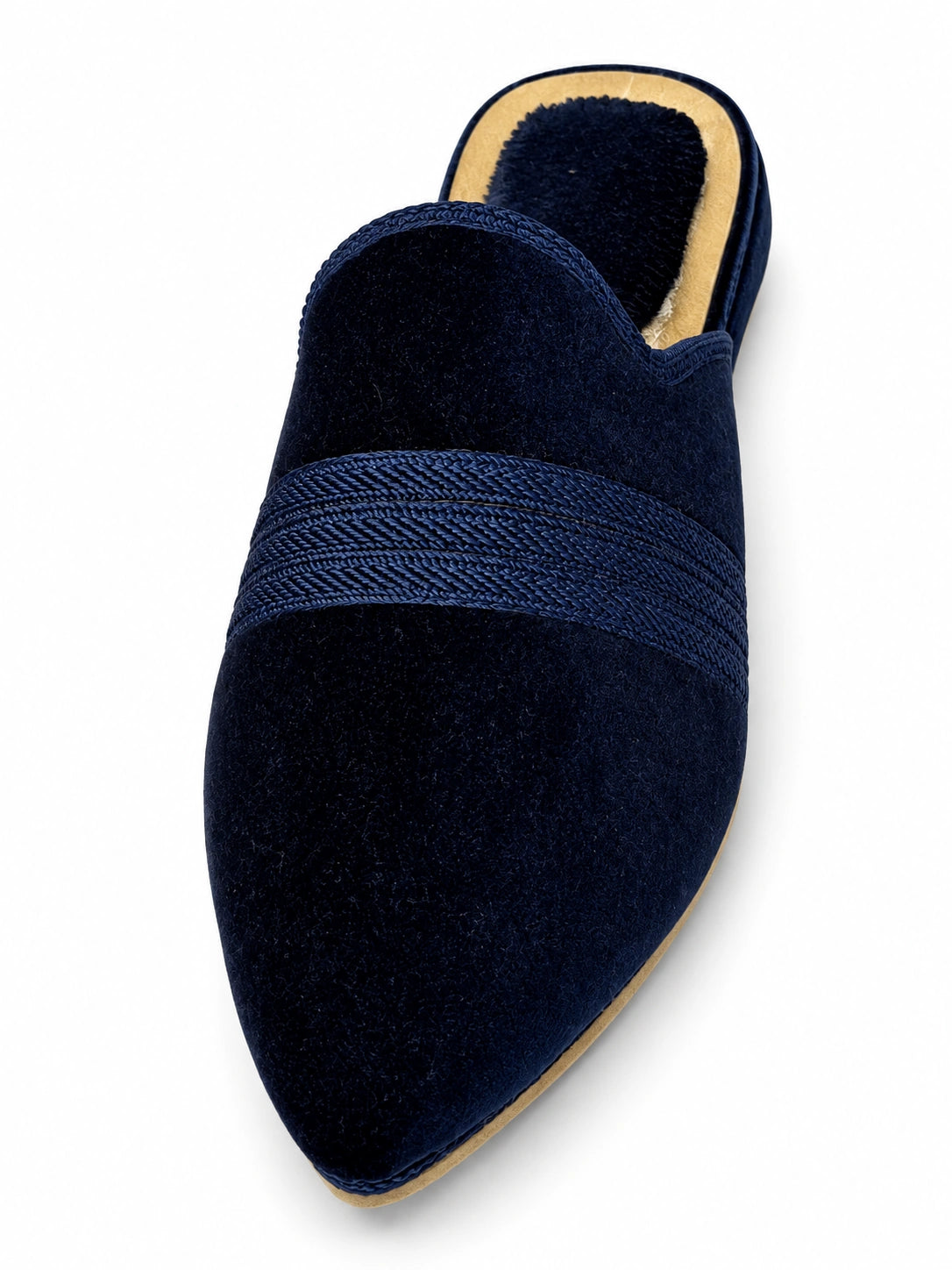 Navy blue pointed-toe babouche with a matching braided band and open back on a white background.