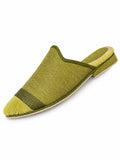 Olive babouches with a pointed, ribbed yellow-green toe and a dark olive braided band, on a white background.