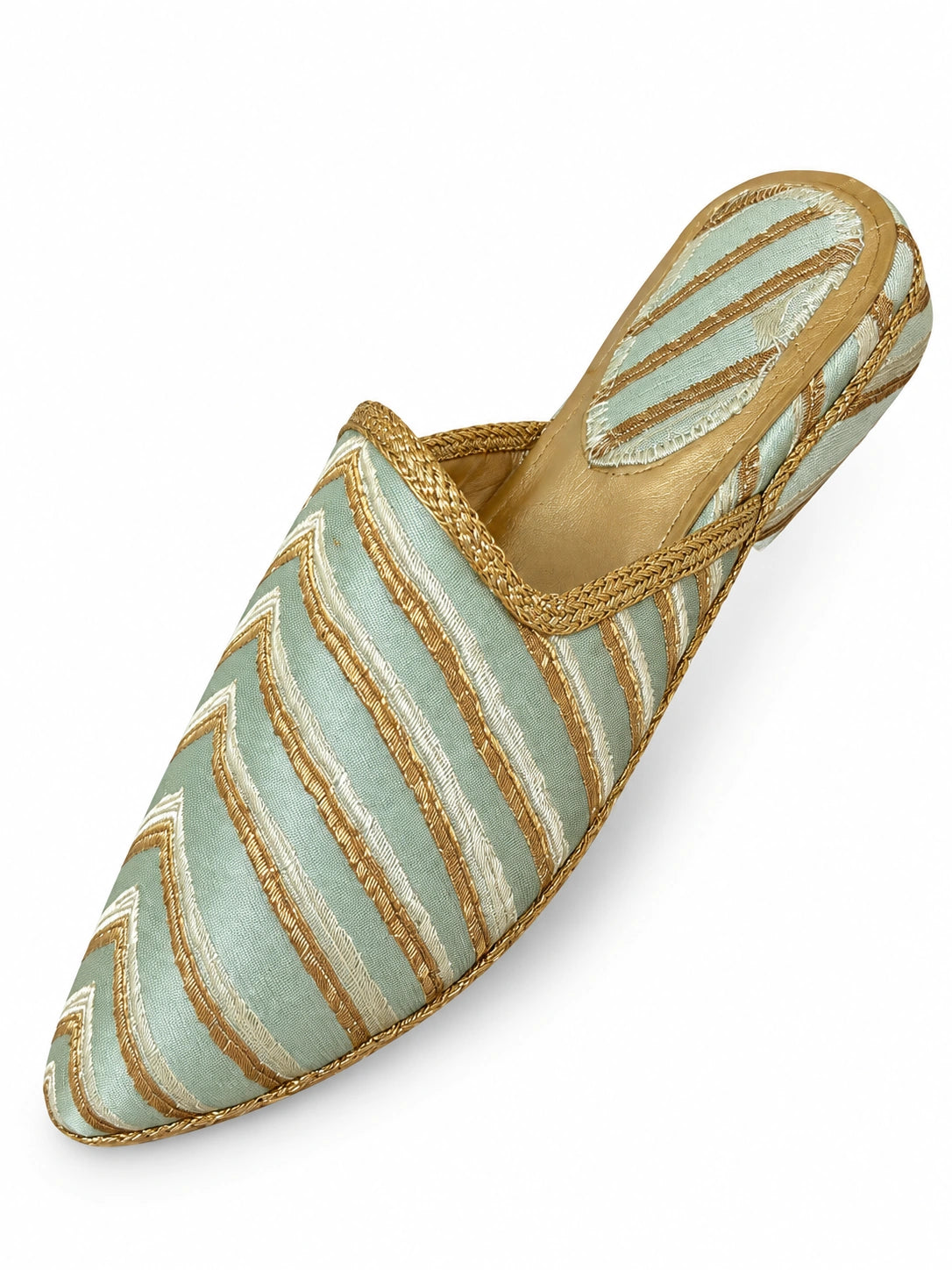 Pale mint green babouche with diagonal ivory and metallic gold stripes, gold braid and a striped heel on white.