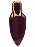 Plum ribbed babouche with matching braided trim, pointed toe and gold-tone footbed, shown on white.