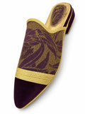 Purple and gold-tone leaf-pattern babouche with gold braided trim and a plain plum pointed toe, shown on white.