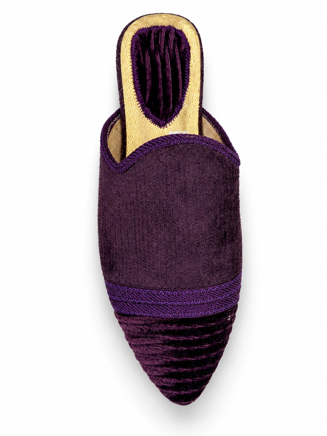 Purple babouche with a tonal braided band and dark striped pointed toe on a white background.