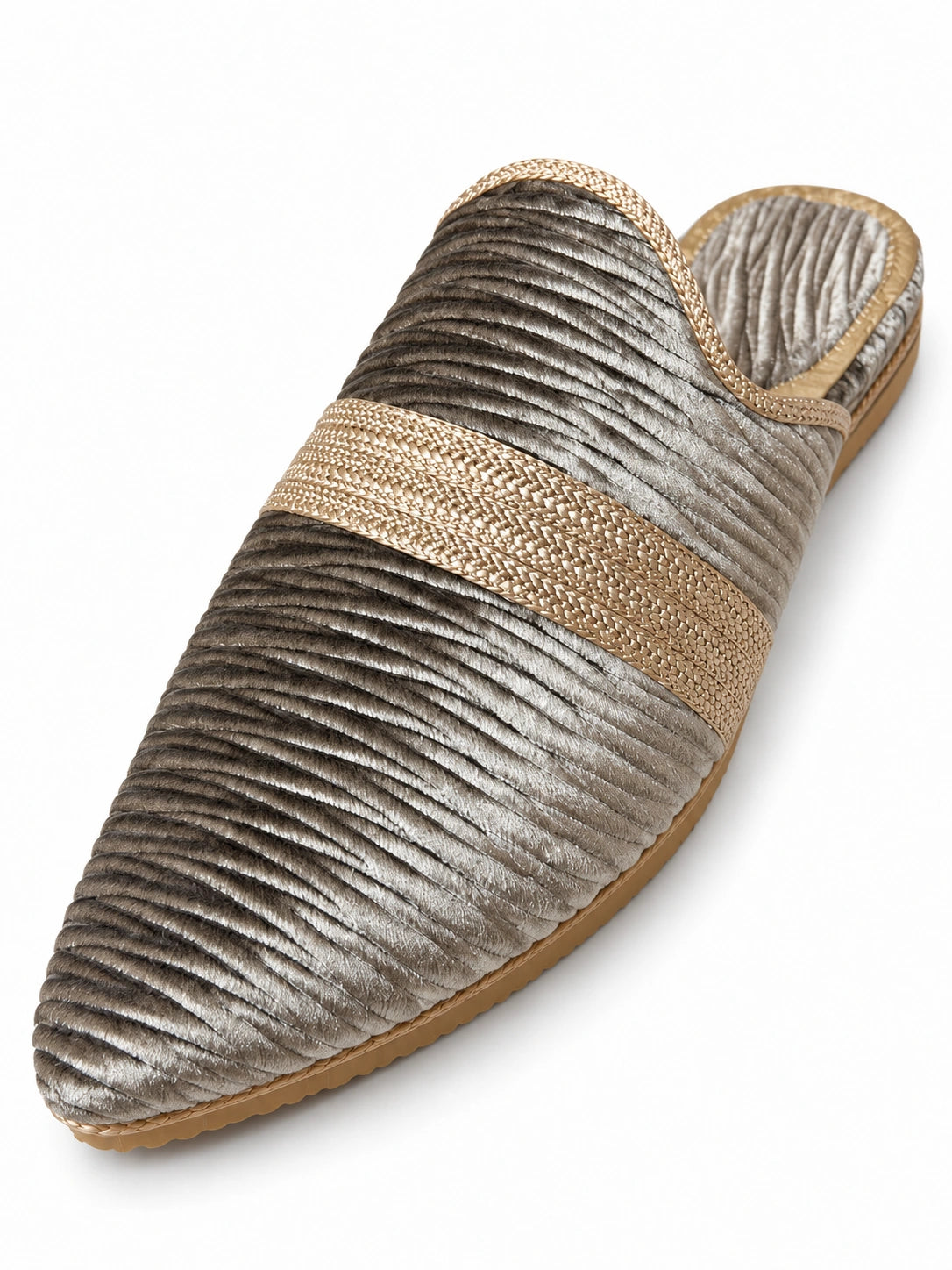 Silver-grey pointed-toe babouche with a wavy ridged texture, champagne braided band and open back on white.