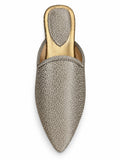 Silver-tone textured babouche with braided edging, pointed toe and gold-tone footbed, shown on white.