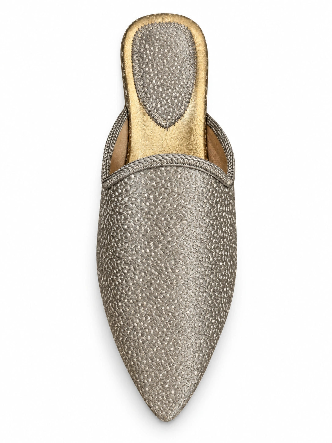 Silver-tone textured babouche with braided edging, pointed toe and gold-tone footbed, shown on white.