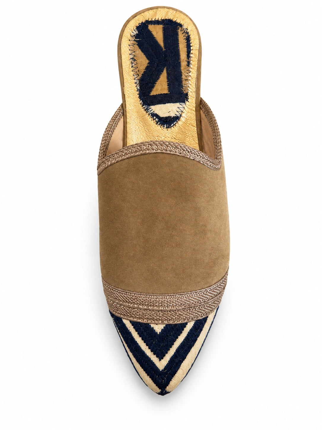 Taupe babouche with a navy and cream geometric pointed toe, braided front band and open back, shown on white.
