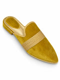 Mustard-yellow babouches with a wide pale gold-tone double braided band across the upper, on a white background.